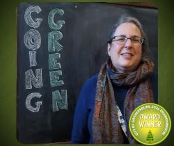 Photo of an Gaithersburg Museum educator accepting a going green award