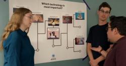 Players looking ar cards on a bracket board 