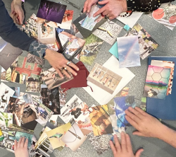 What is learning photo cards spread out on a table with people's hands sorting through them