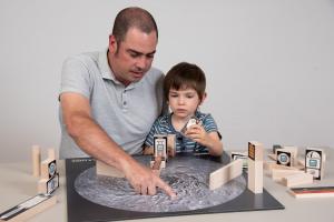 Facilitator and Learner arrange blocks on a Lunar crater map