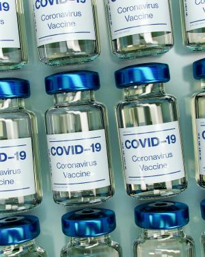 COVID vaccine image credit Daniel Schludi on Unsplash