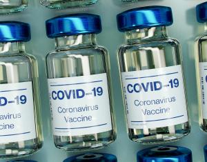 COVID vaccine image of glass vials labeled COVID-19 Coronavirus Vaccine