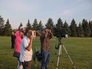 Guests at RMSC viewing the 2021 Partial Eclipse