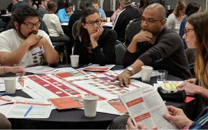 NOAA Climate Hazard Resilience heat forum with people sitting around tables talking