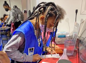 miSci Schenectady NY visitor playing the Moon Adventure Game