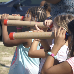 NASA TEAM II notice of funding with children looking through cardboard tube