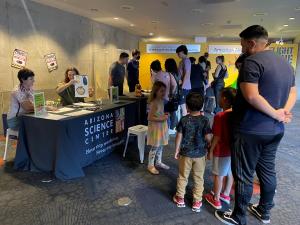 NanoDays activities at Arizona Science Center October 2023 with visitors waiting at a table