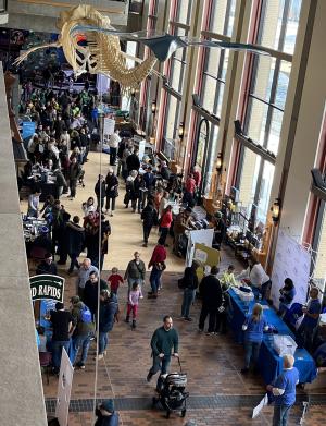 Aerial view of a long hallway with many visitors and many activities