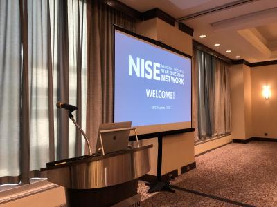 ASTC 2022 Breakfast projector screen and podium with microphone
