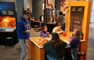 Build a Human Habitat on Mars group of visitors building with bricks