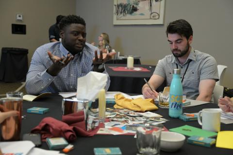 two educators at the sustainability fellowship meeting