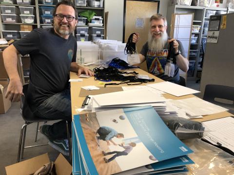 Brad Herring at a 2019 meeting in Tempe Arizona making nametags with Darrell Porcello