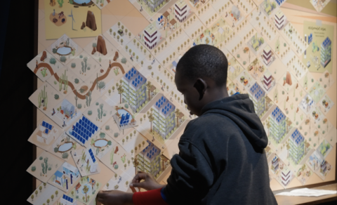 Mission Future exhibition young visitor utilizing magnet wall