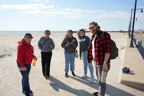 Five Museum Staff Pose for a Group Photo at the Beach