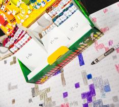 Color a Pixel activity with numbered squares and crayons for each color