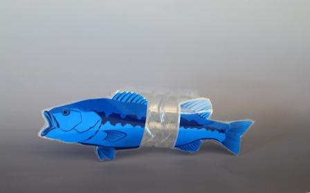 model of a blue fish with a metallic ring around its waist 