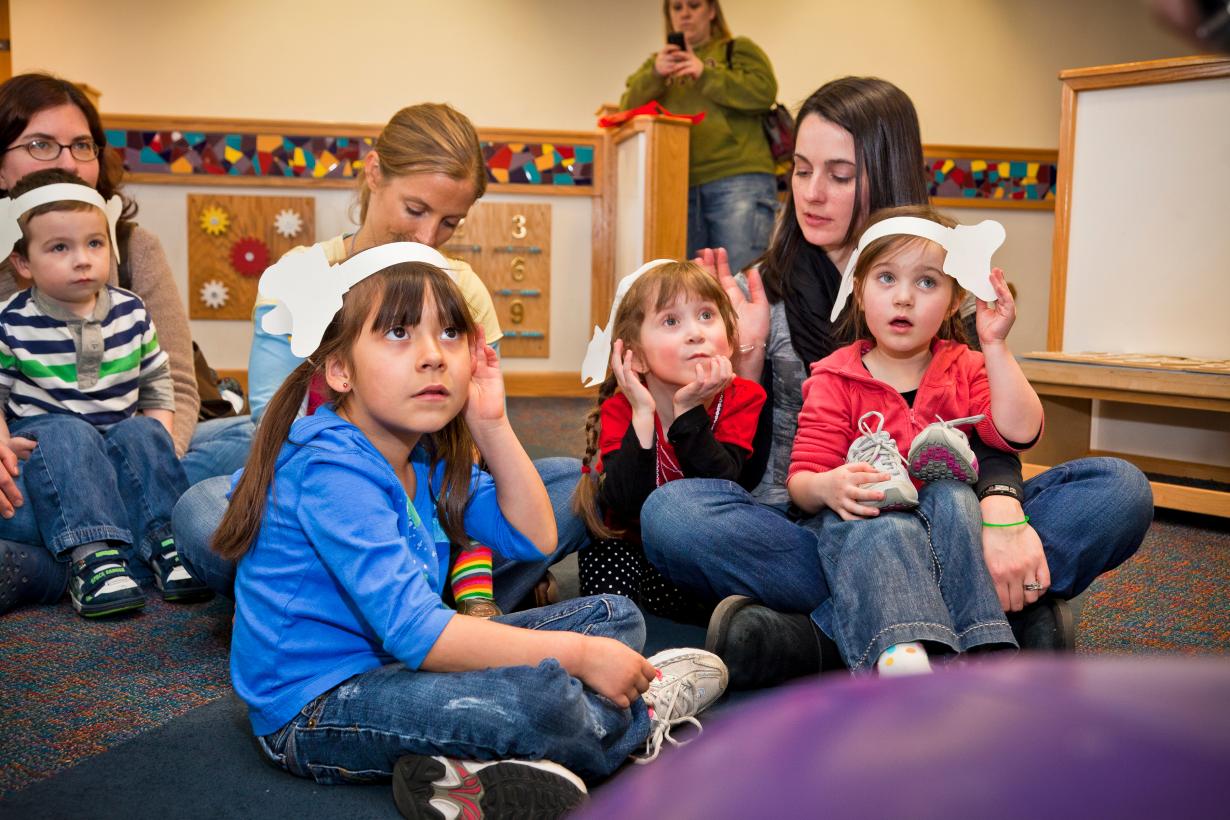 Children listening wearing paper elephant ears in Horton Senses Something Small NanoDays activity