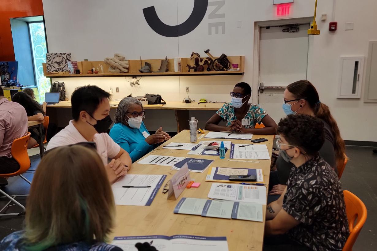 Photo of a group of people discussing Human Genome Editing at a public forum