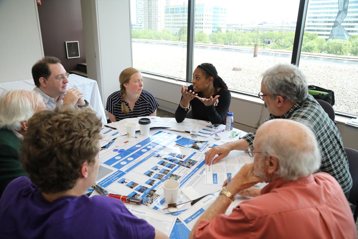 Climate Hazard Resilience extreme precipenation forum of peple talking around a table