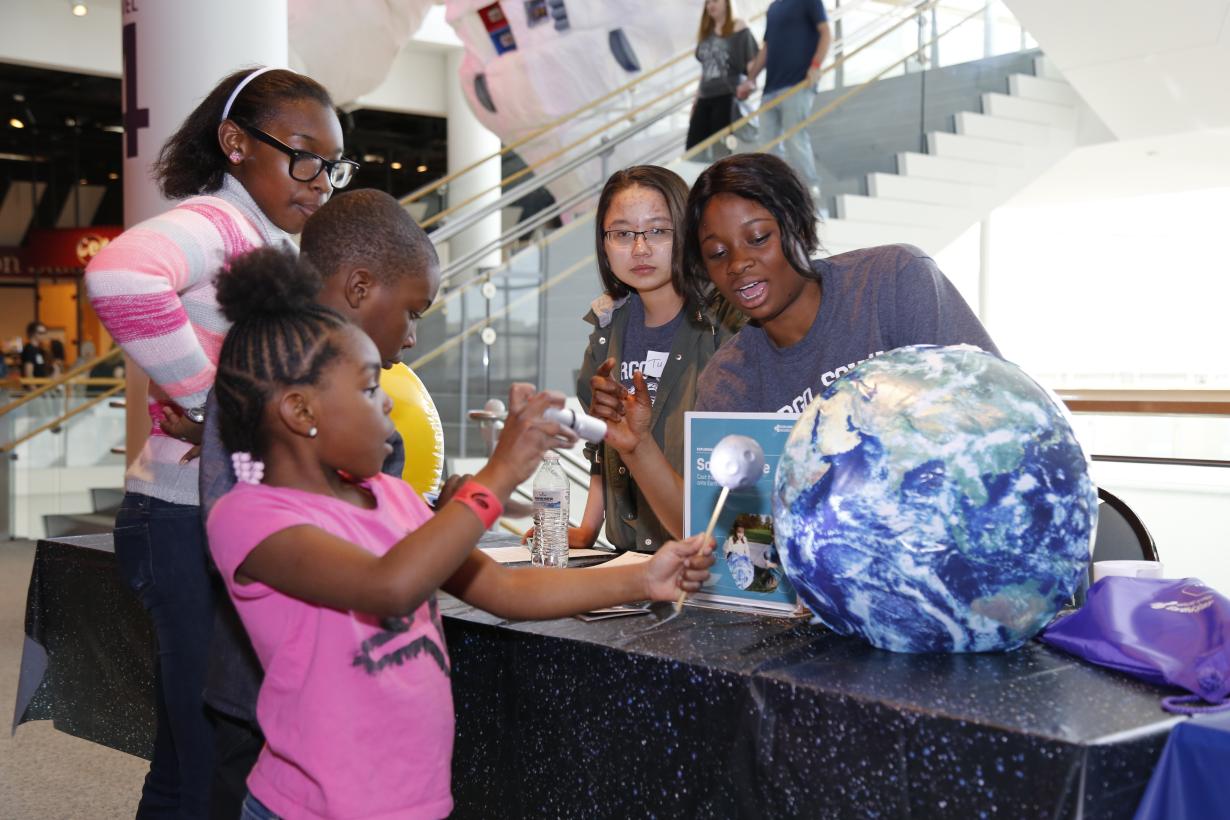 Solar Eclipse ativity with young museum visitors at 2017 Science Museum of Minnesota Earth Day event