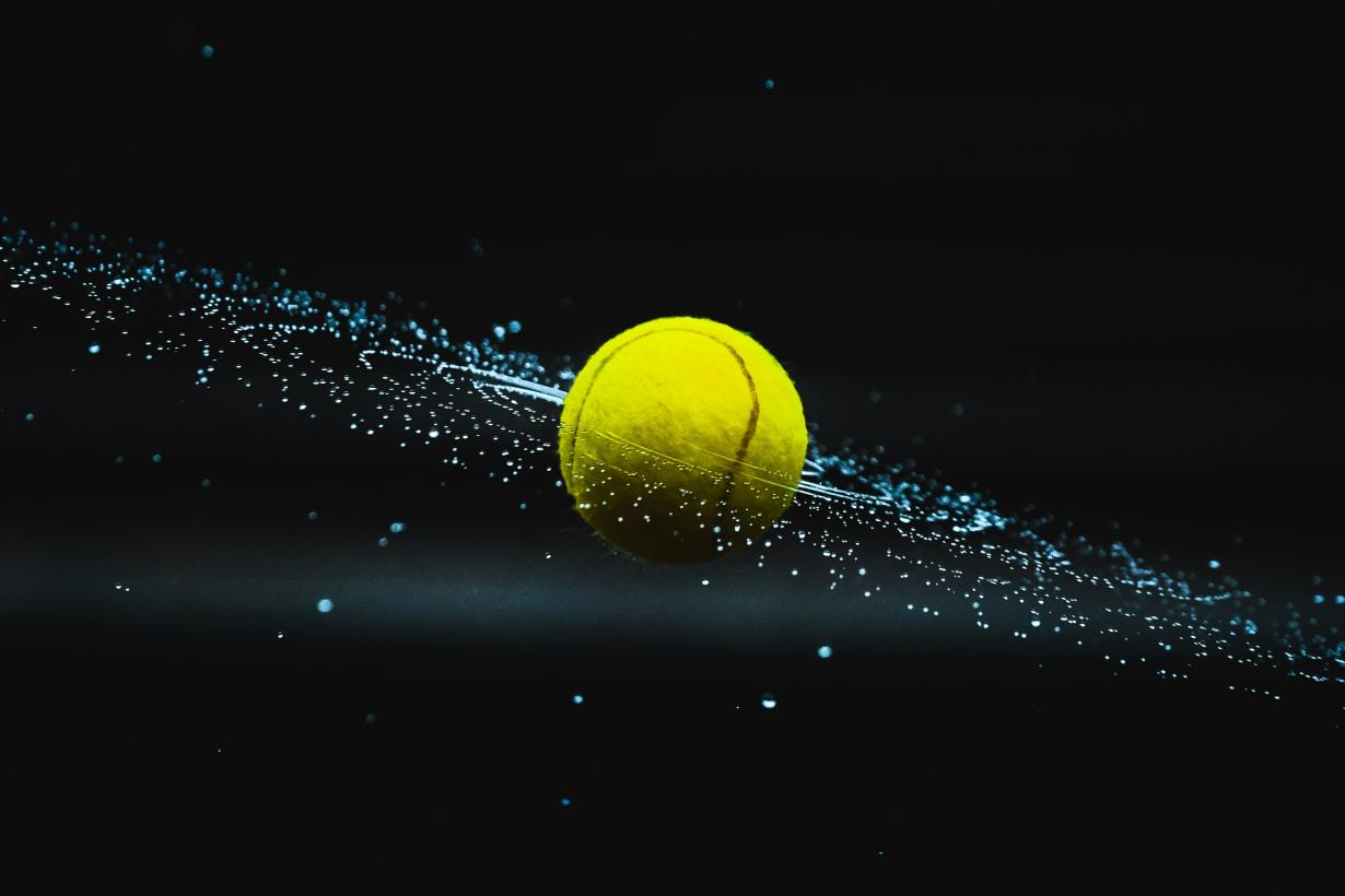 Tennis ball with dots showing rotational spin 