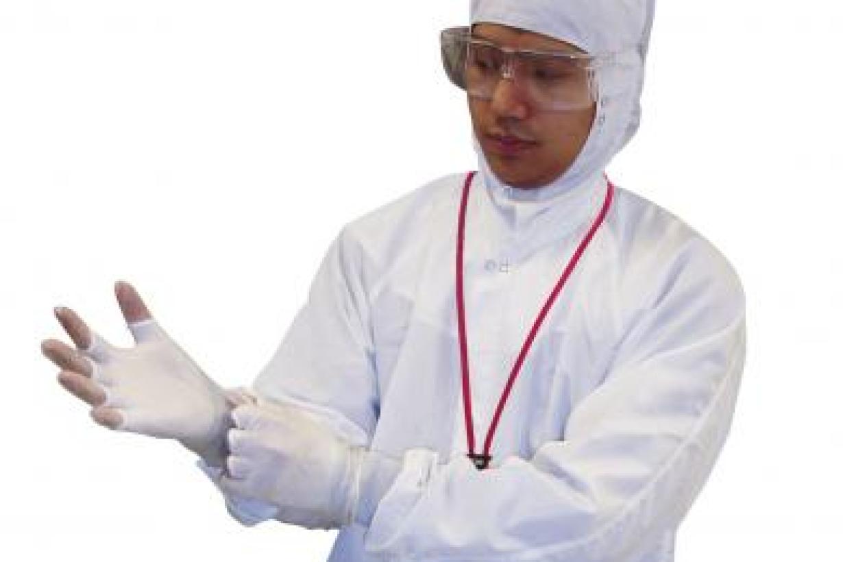 Nanoscientist dressing to go into a clean room