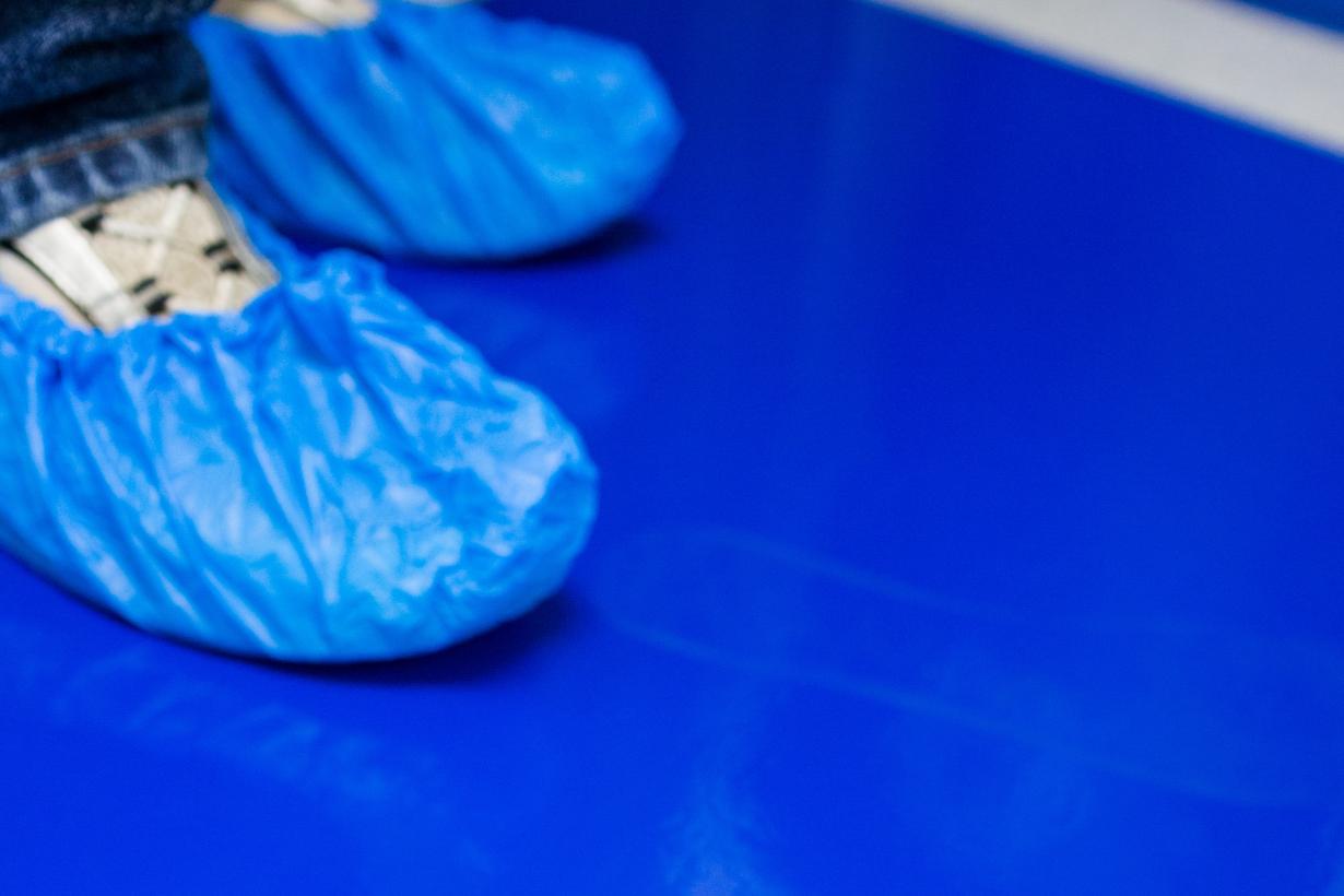 Photograph of cleanroom sticky mat and booties in a nanotechnology fabrication lab.