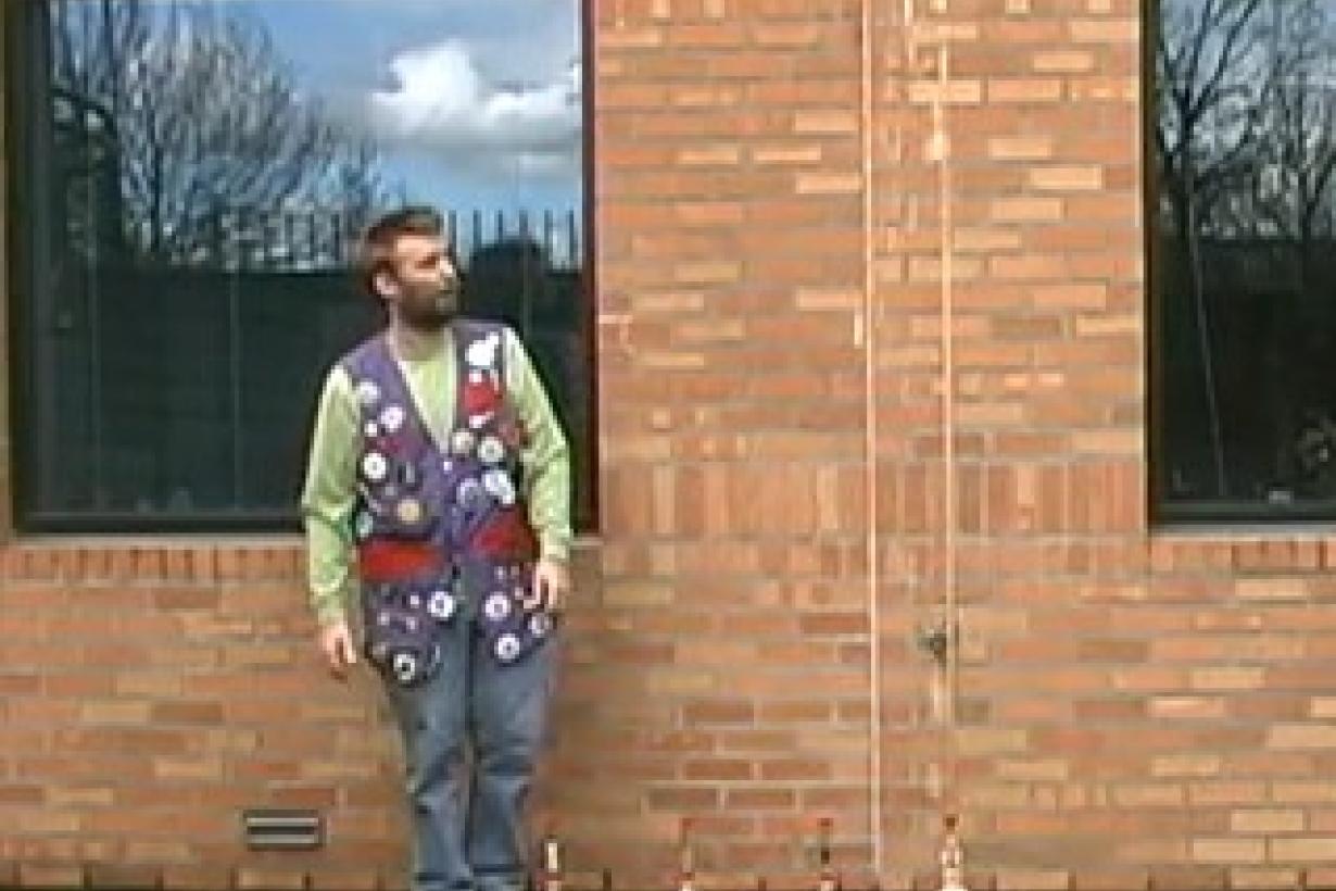 Facilitator standing next to a erupting bottle of soda