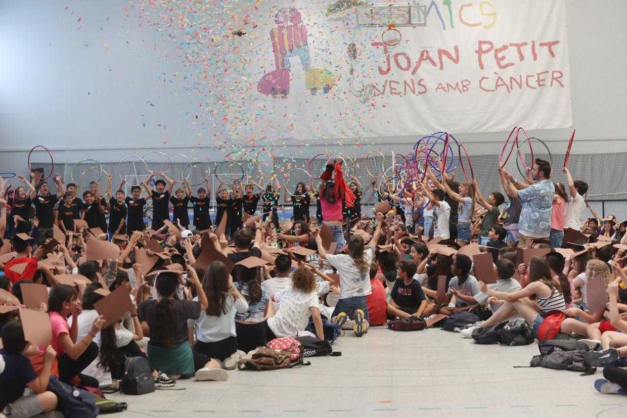 A Large Group of Students Sit and Stands During Celebrations for the NanoRobot Challenege
