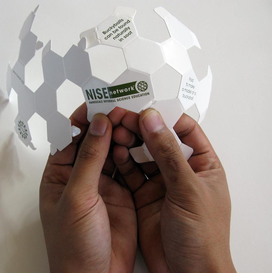 Paper Buckyball structure being folded into shape