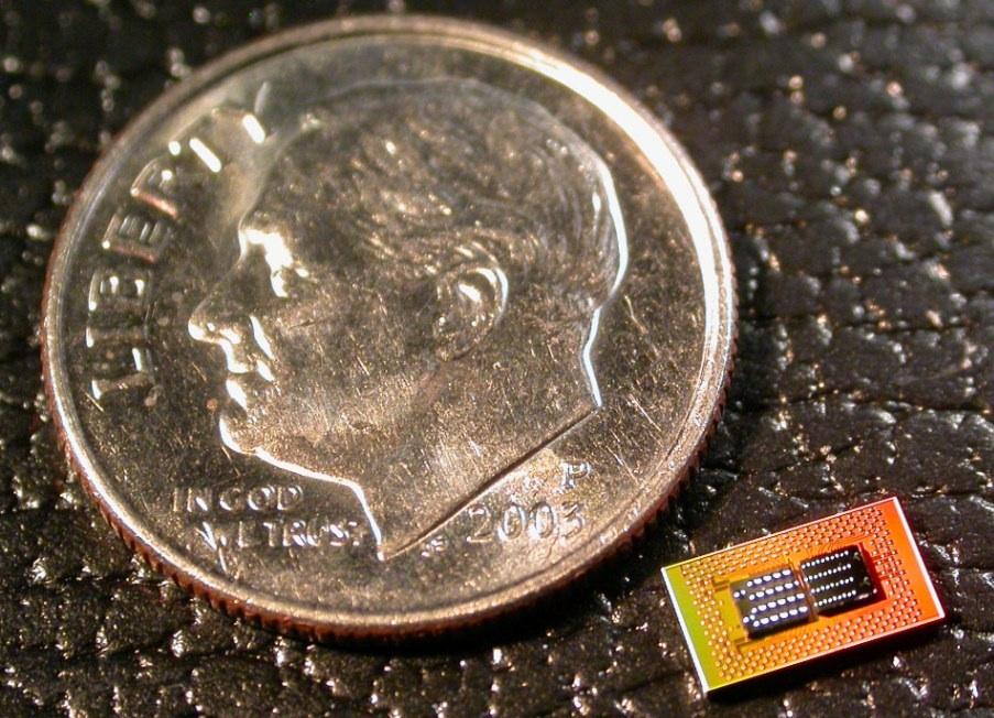Computer chip compared to the size of a dime