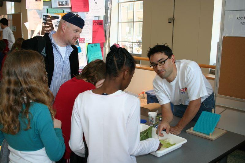 Facilitator showing learners the lotus leaf effect