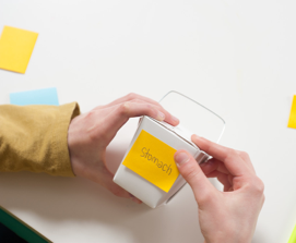 Learner putting yellow sticky label on takeout container as part of virus delivery model