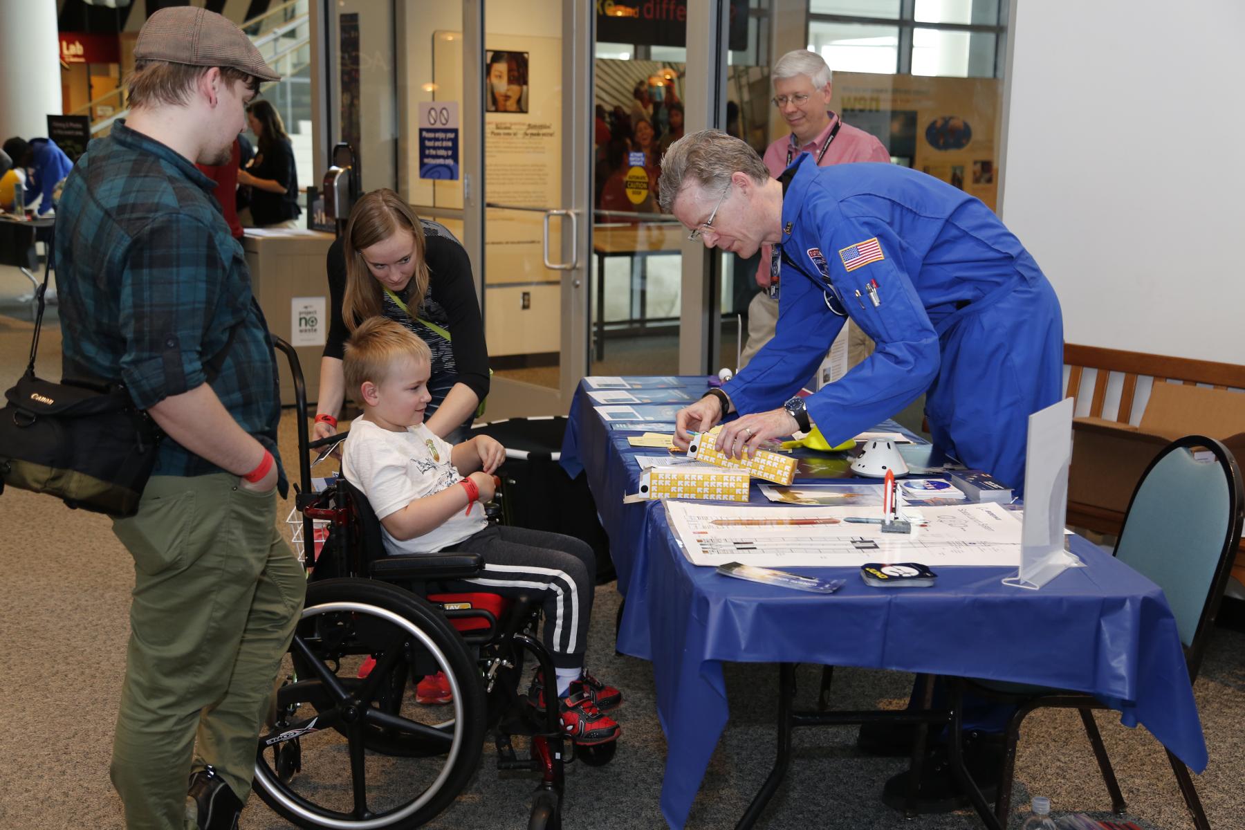 Solar System Ambassador facilitating an activity at an Earth and Space event
