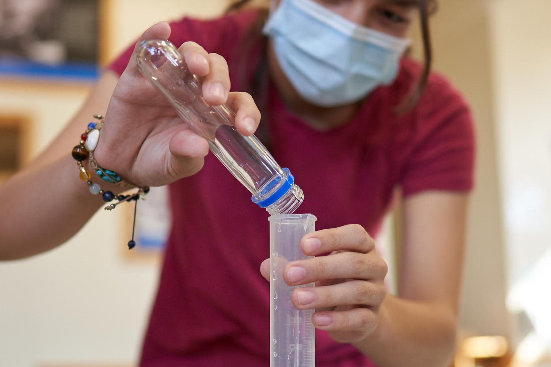 Learning pouring into a graduated cylinder 