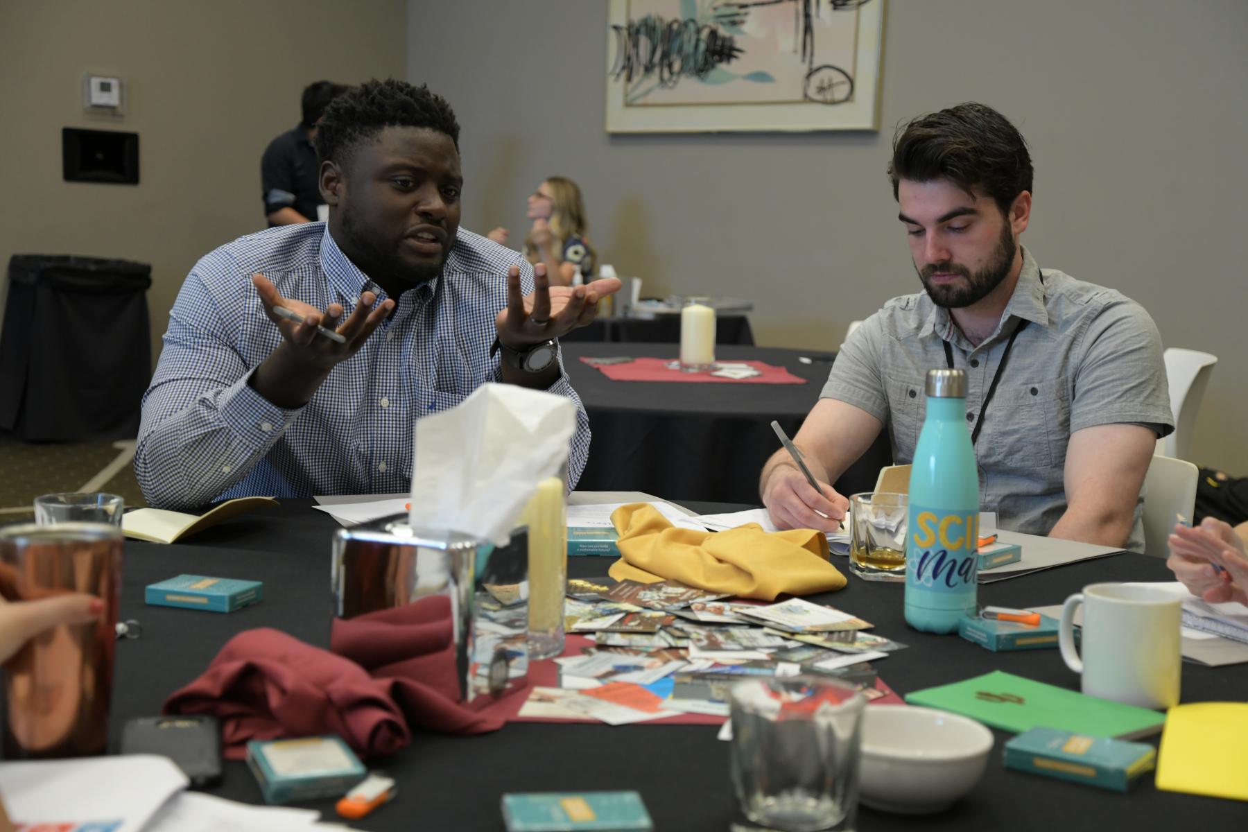 two educators at the sustainability fellowship meeting 