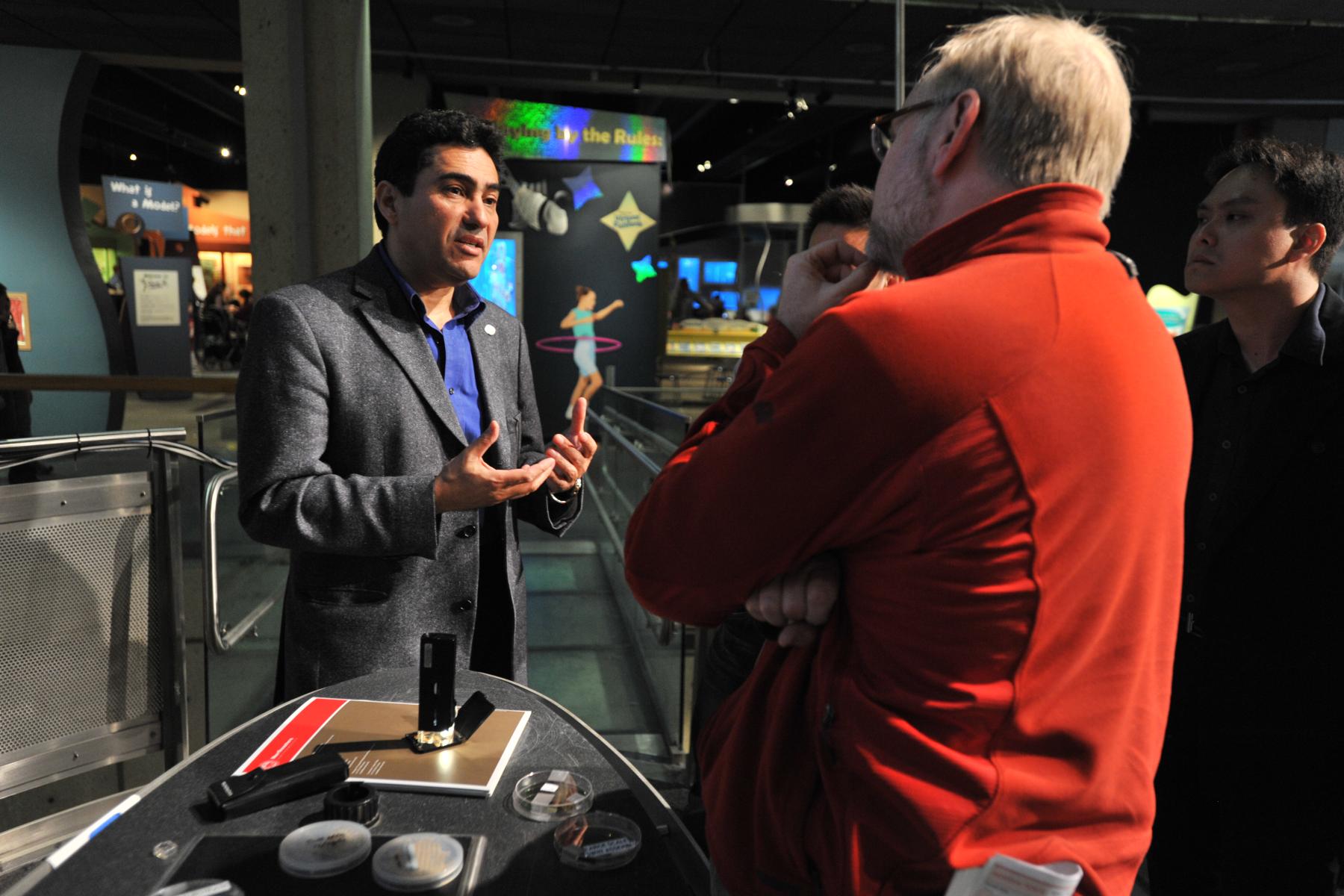 An expert talking with an event participant 