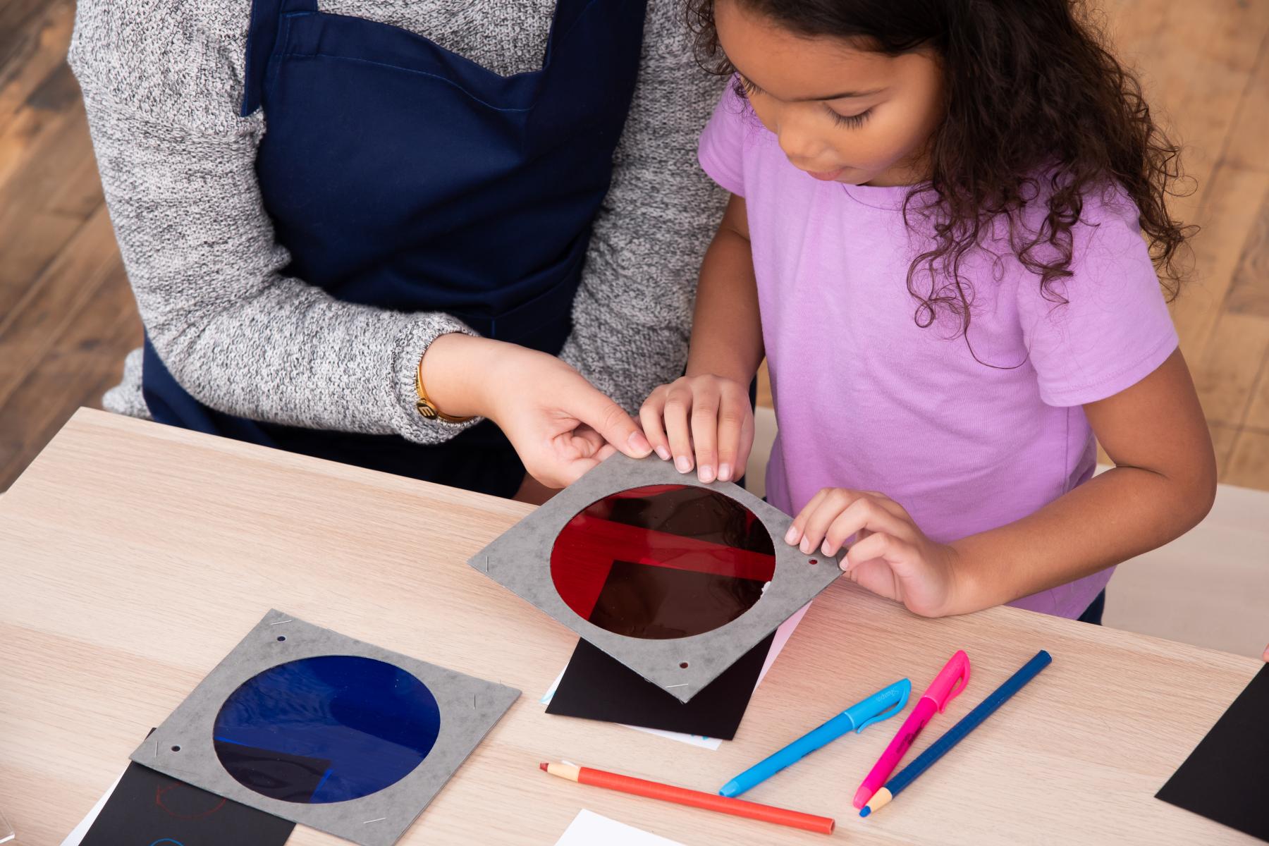 Educator showing learner how to use a color gel 