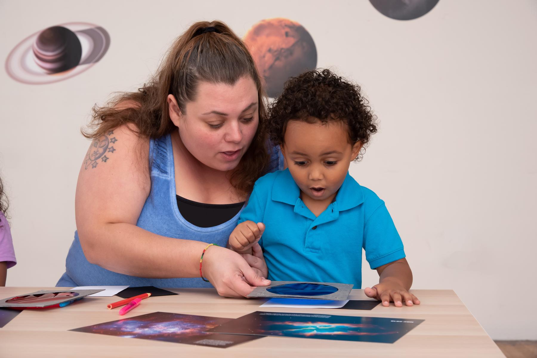 A family looks at an image through a blue filter