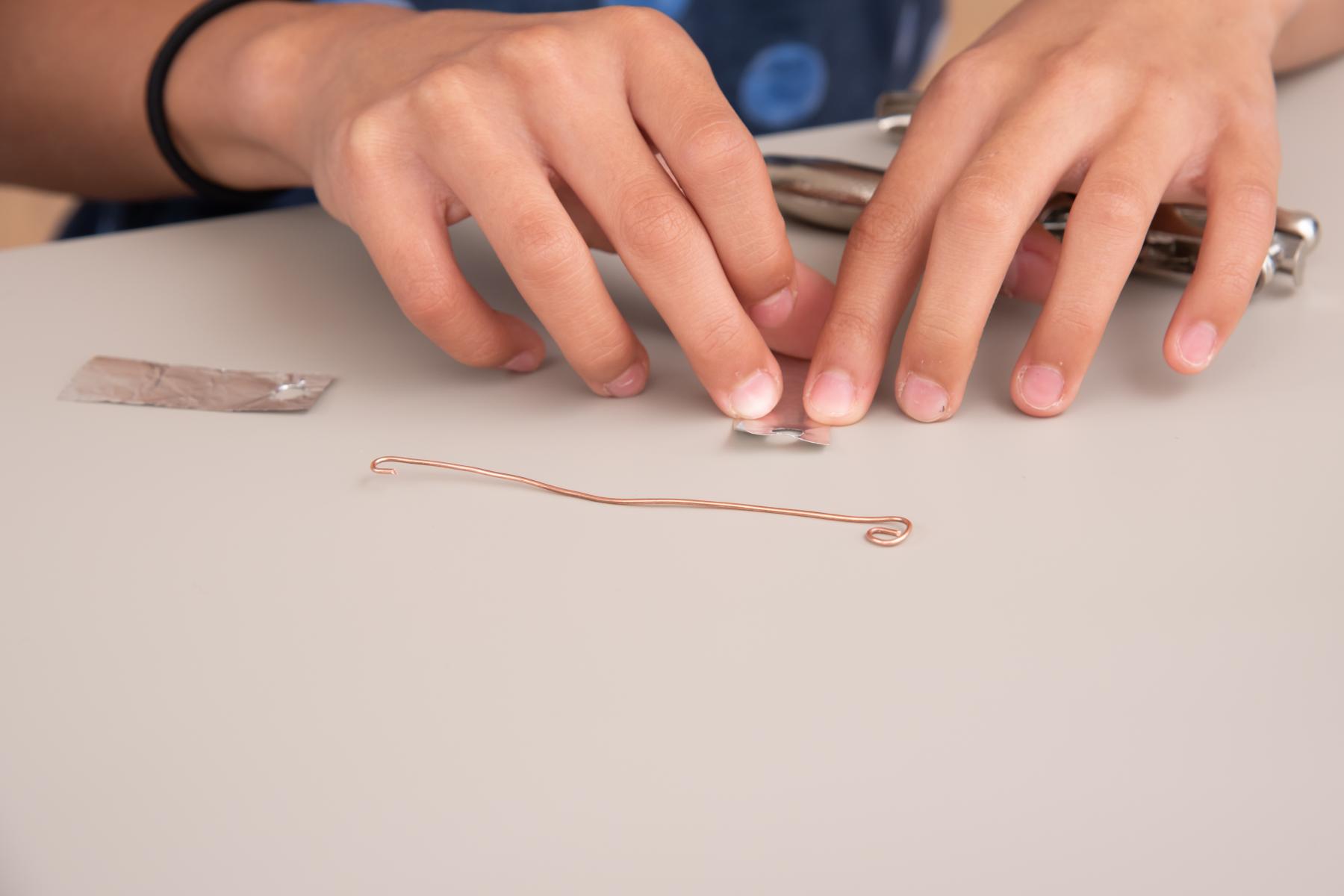 Learner assembles their static electroscope