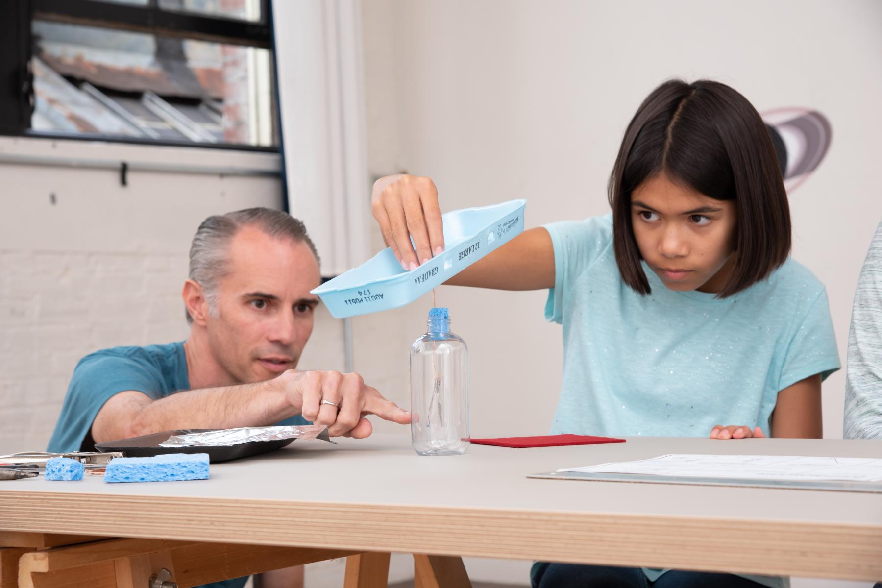 A learner and a facilitator use their electroscope