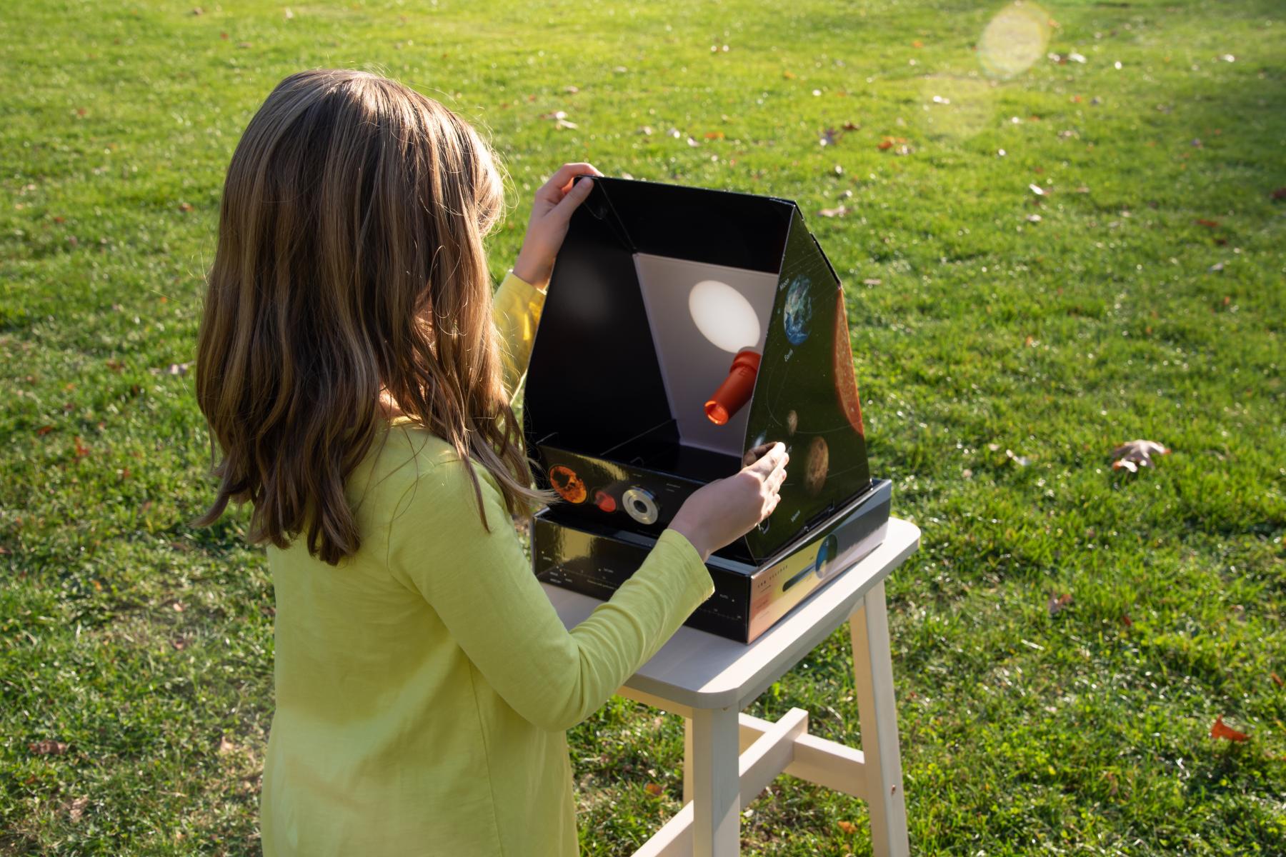 Learner sets up and points solarscope at the sun