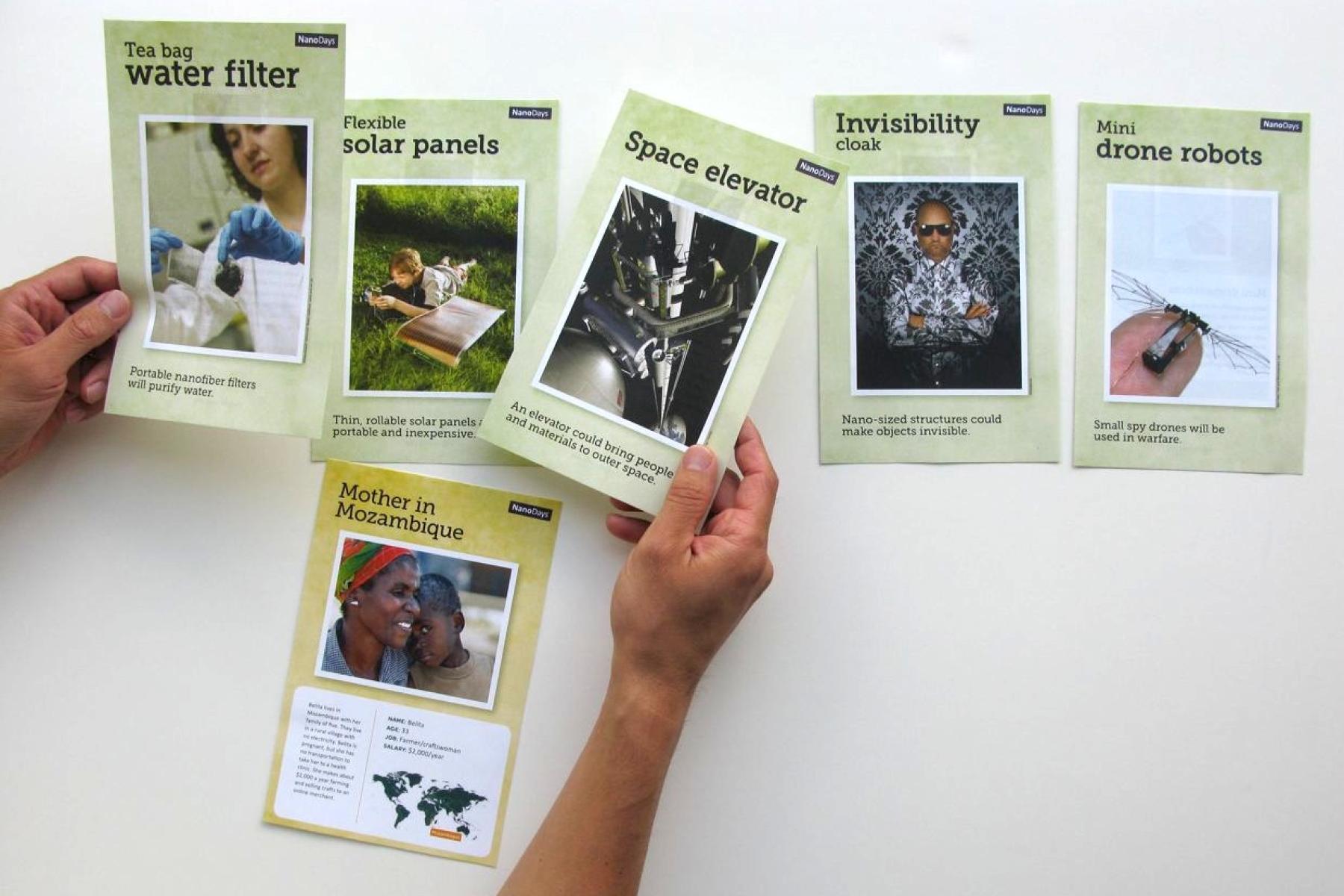 An overhead shot of a learner holding and comparing different theoretical technologies summarized on sheets of paper