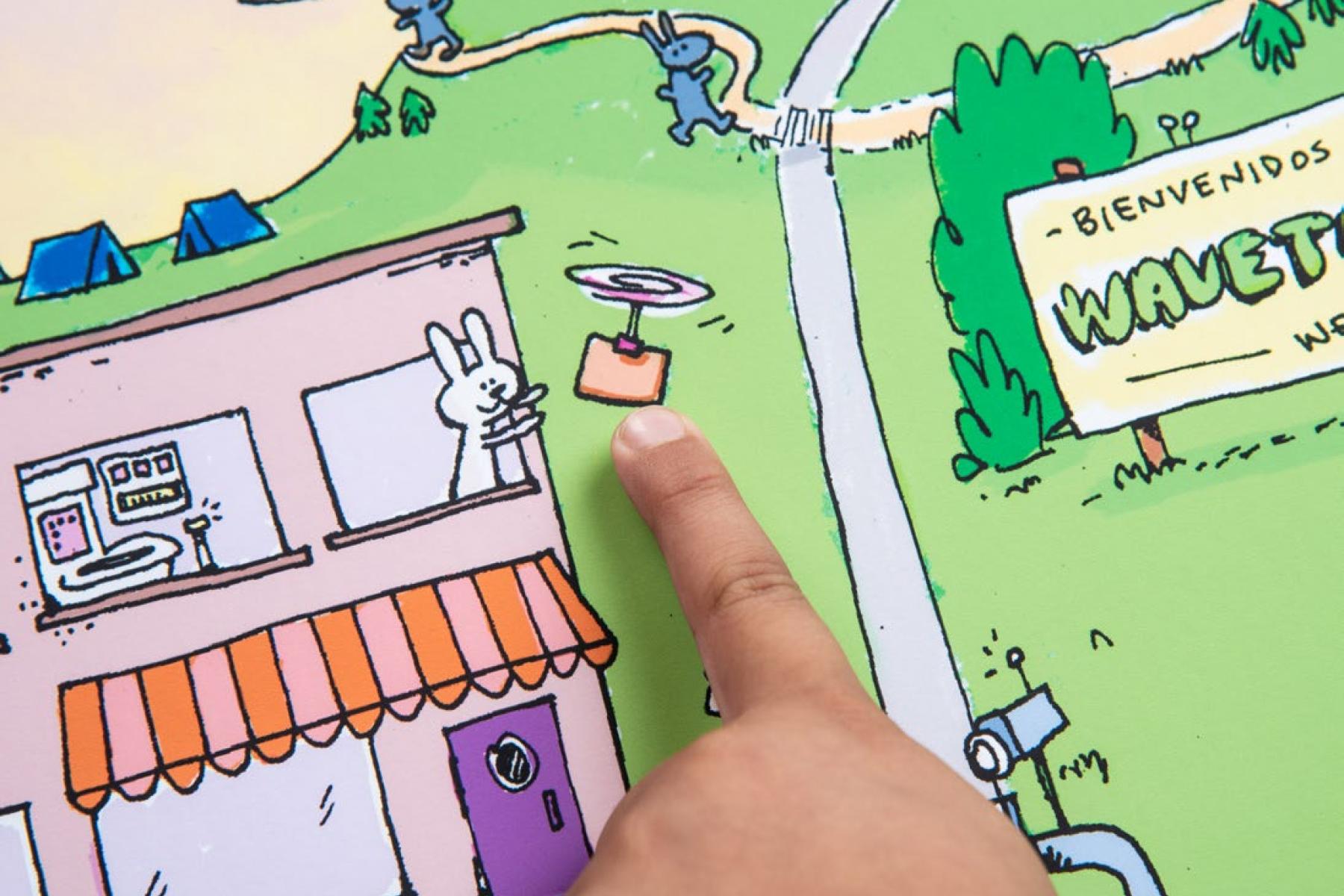 A finger points to a flying drone on the Wavetown illustration.