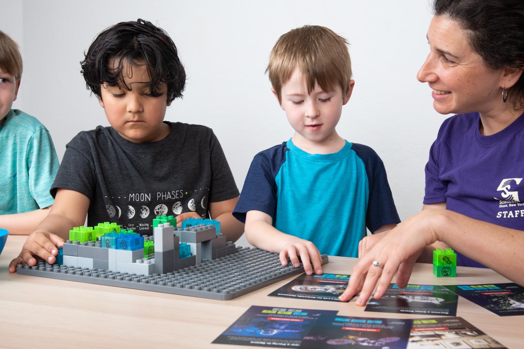 Voyage through the Solar System Build a Moon Base Camp learners using building bricks 