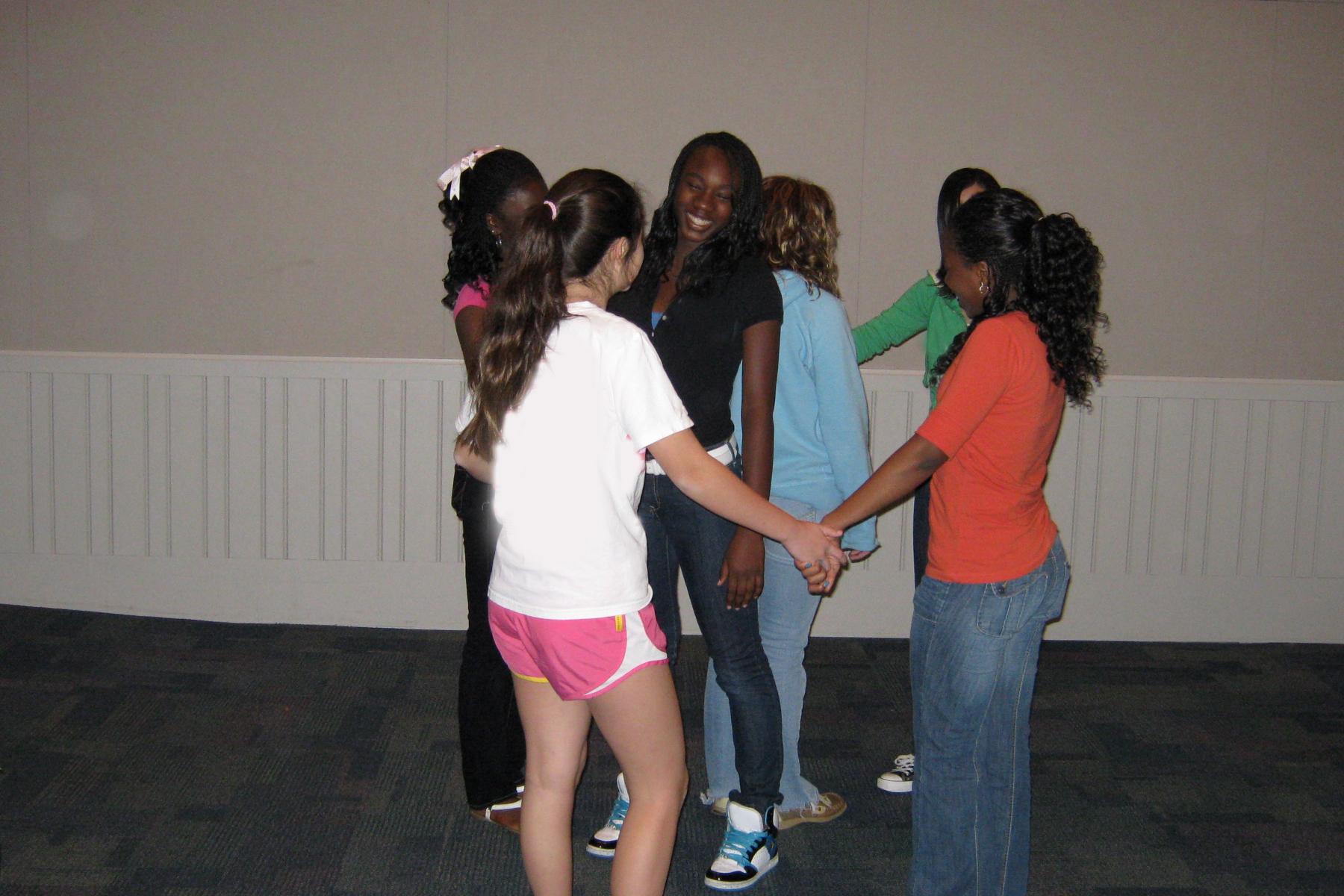 Ready Set self assembly activity with children holding hands in a group