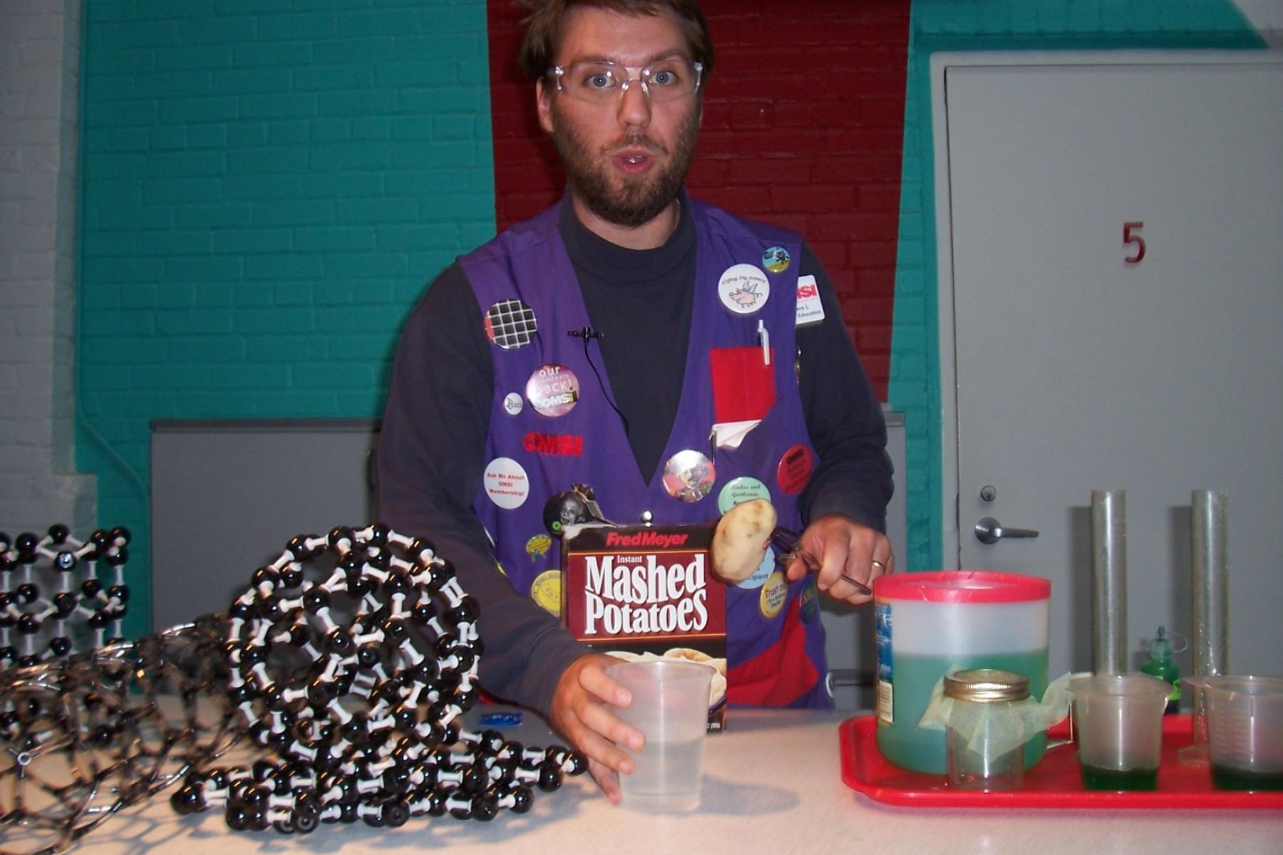 Facilitator runs a nanotechnology cart demonstration 