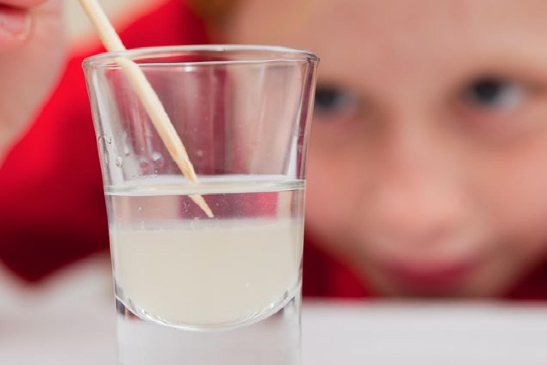 Girl looking at liquid in a cup using DIY Nano See DNA activity