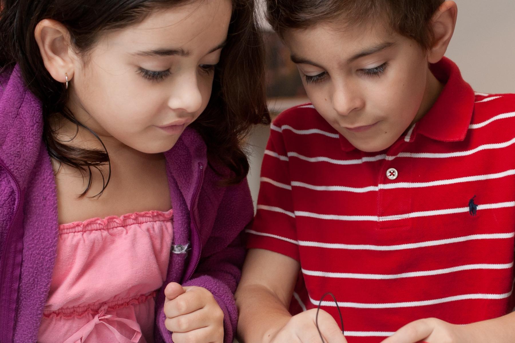 Two kids doing the liquid crystal display activity