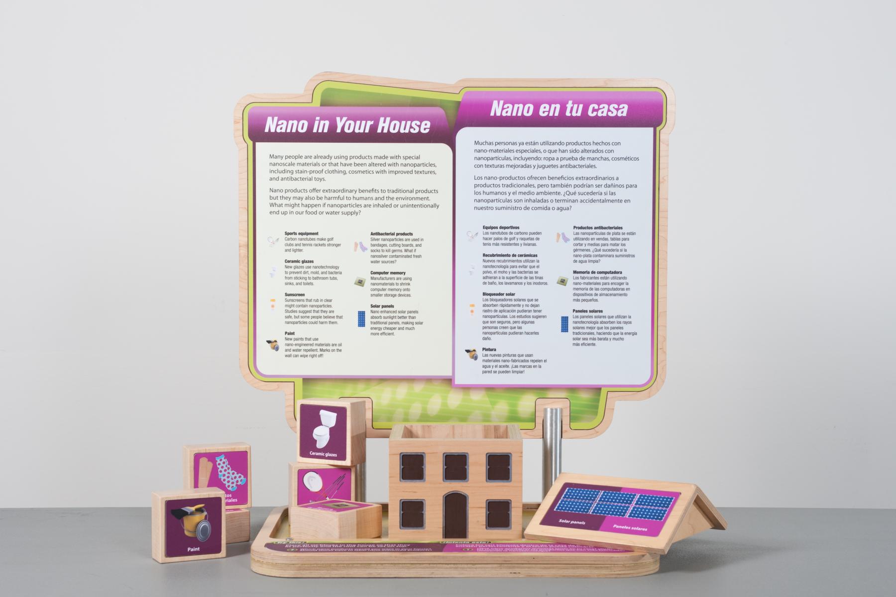 interactive wooden house model with various represented nano technologies on wooden blocks that can be placed into the house model 